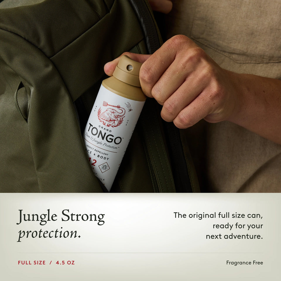 Grand Tongo Fragrance Free Full Size Spray, 4.5 oz being placed in a bag pocket. Jungle Strong protection. The original full size can, ready for your next adventure.