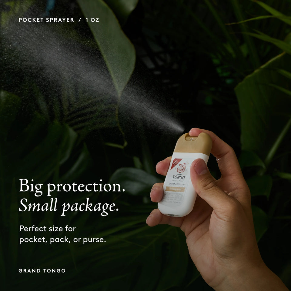 Grand Tongo Fragrance Free Pocket Spray, 1 oz held in a hand, dispensing a visible mist against dark green foliage. Big protection. Small package. Perfect size for pocket, pack, or purse.