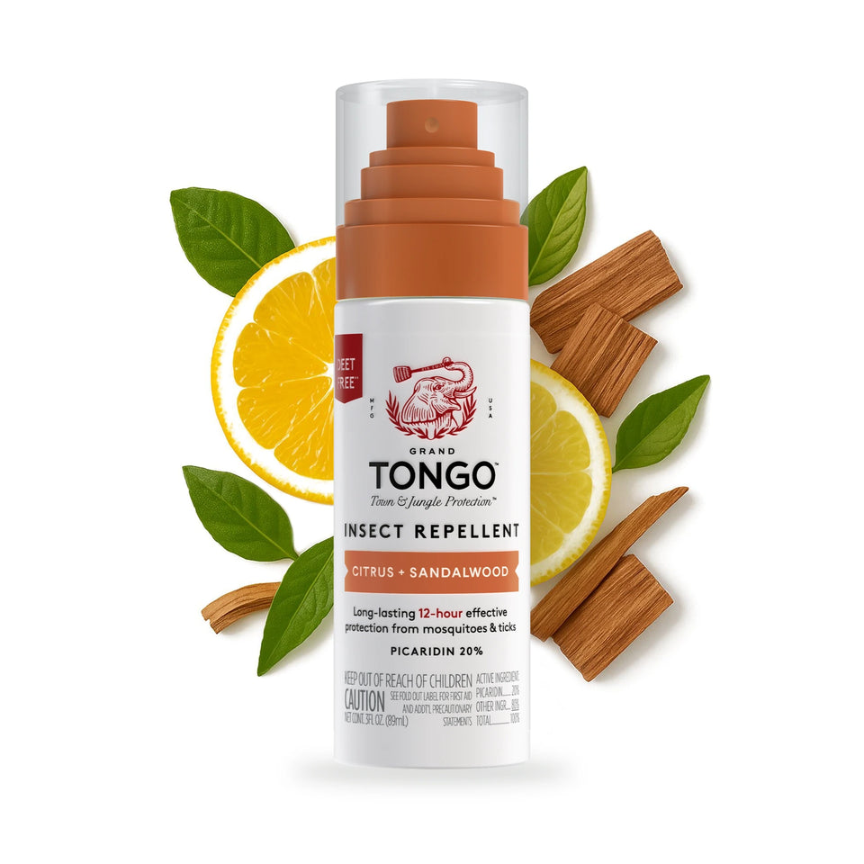 One Grand Tongo Citrus + Sandalwood Travel Pump Spray, 3 oz on a white background with citrus slices, green leaves, and sandalwood behind the product.