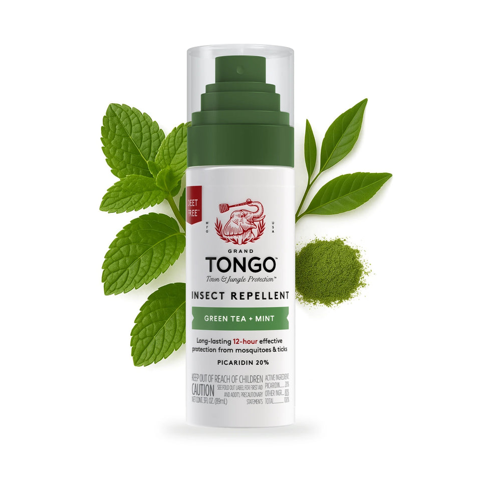 One Grand Tongo Green Tea + Mint Travel Pump Spray, 3 oz on a white background with green tea and mint leaves and green tea powder behind the product.